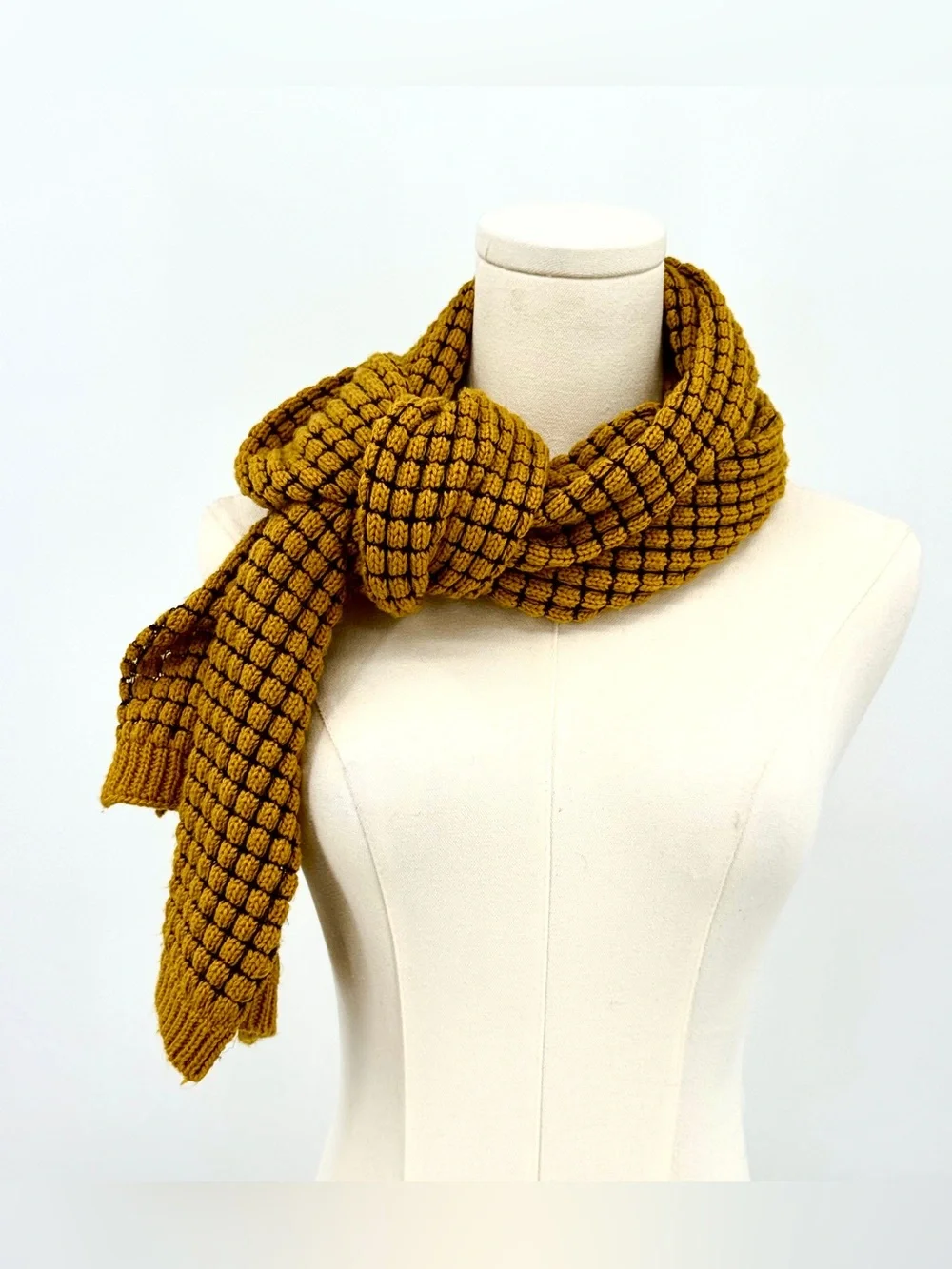 Extra long knit scarf in mustard yellow.
